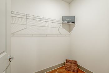 A walk in closet with a wire shelf at anthem luxury homes and apartment rentals in huntsville, al